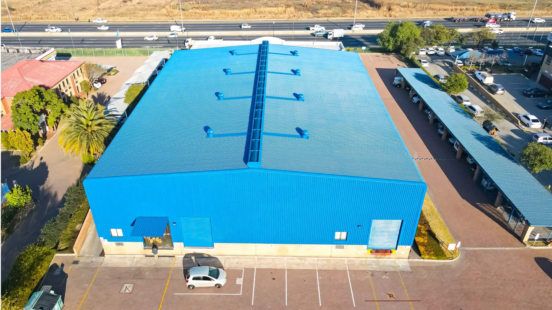 Maintenance inspection on a warehouse roof in Johannesburg