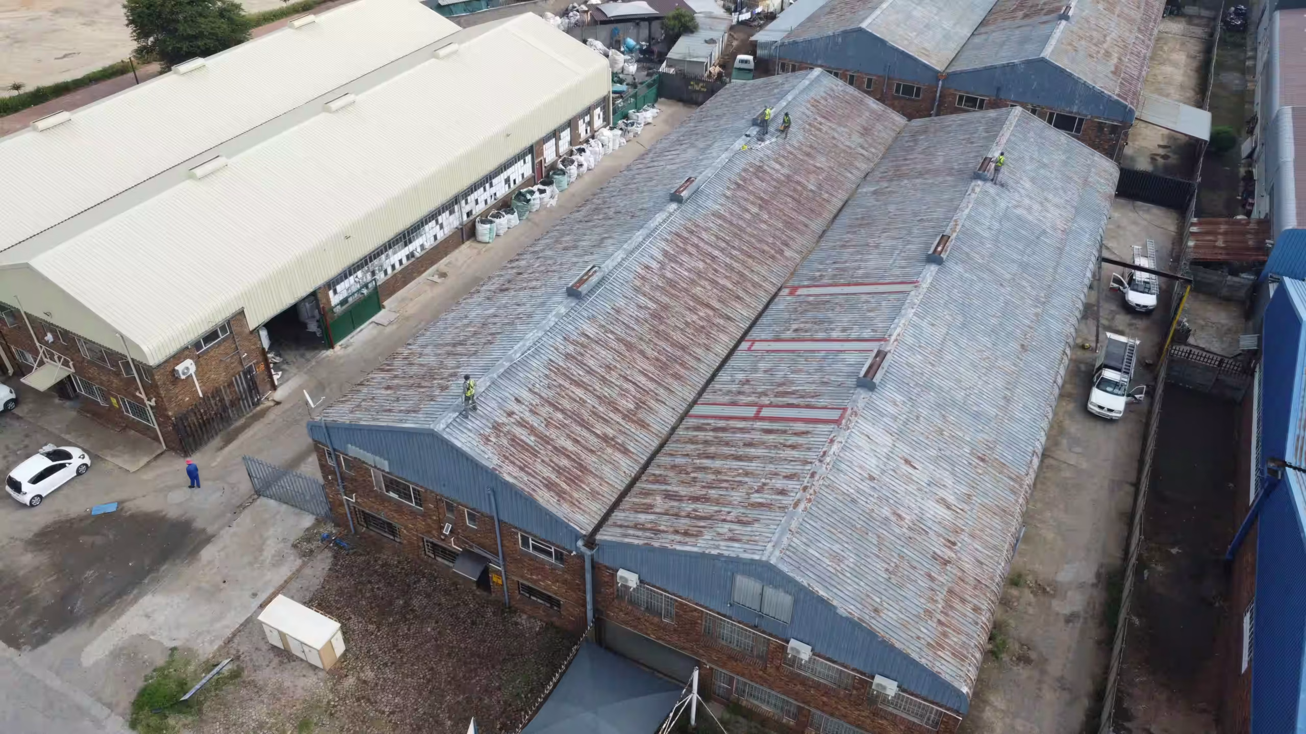 Leaking commercial roof with ponding water before waterproofing in Gauteng